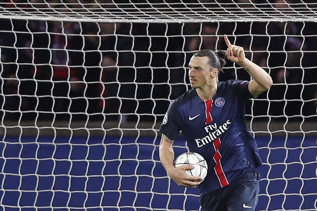 PSG's Zlatan Ibrahimovic collects the ball after scoring his side's first goal during the Champions League quarterfinal first leg soccer match between Paris St Germain and Manchester City at the Parc des Princes stadium in Paris, Wednesday, April 6, 2016. (AP Photo/Christophe Ena)
