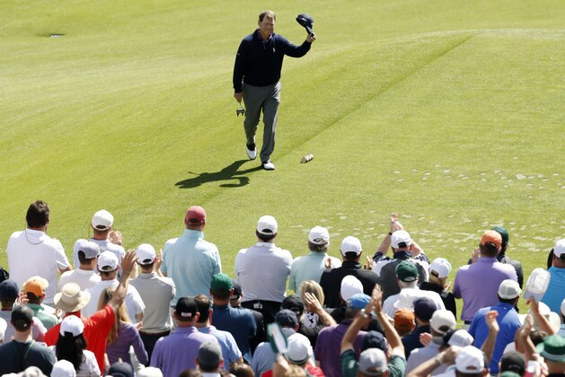 Apr 8, 2016; Augusta, GA, USA; Tom Watson tips his cap to the gallery as he walks to the 12th tee during the second round of the 2016 The Masters golf tournament at Augusta National Golf Club. Mandatory Credit: Rob Schumacher-USA TODAY Sports