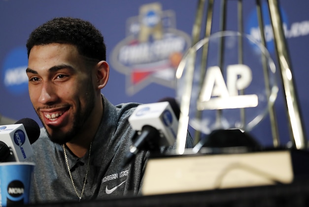 Michigan State's Denzel Valentine answers a questions with his Associated Press Player of the Year trophy at a news conference at the NCAA Final Four college basketball tournament Thursday, March 31, 2016, in Houston. (AP Photo/David J. Phillip)