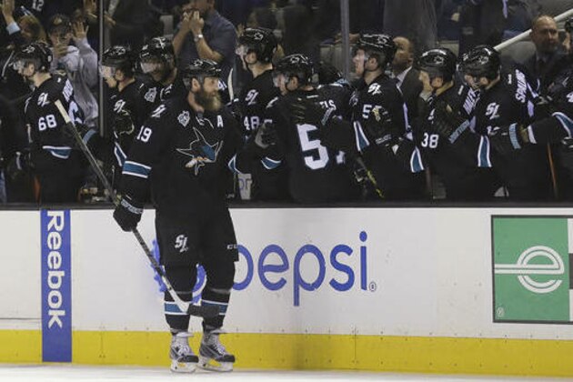 San Jose Sharks center Joe Thornton (19) celebrates with teammates after scoring against the Winnipeg Jets during the second period of an NHL hockey game in San Jose, Calif., Thursday, April 7, 2016. (AP Photo/Jeff Chiu)