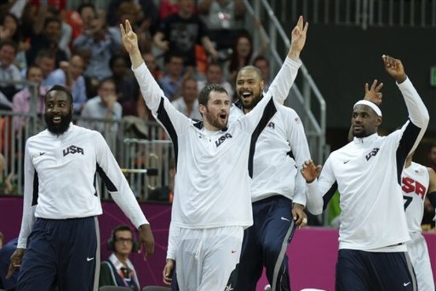USA's Kevin Love raises his arms as he celebrates after a 3-pointer by teammate Carmelo Anthony during a men's basketball game against Nigeria at the 2012 Summer Olympics, Thursday, Aug. 2, 2012, in London. (AP Photo/Charles Krupa)