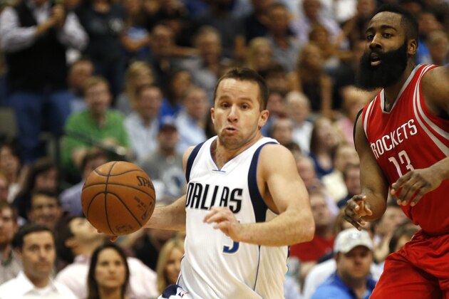 Dallas Mavericks guard J.J. Barea, left, drives inside as Houston Rockets guard James Harden (13), right, defends during the second half of an NBA basketball game, Wednesday, April 6, 2016, in Dallas. The Mavericks won 88-86. (AP Photo/Ron Jenkins)