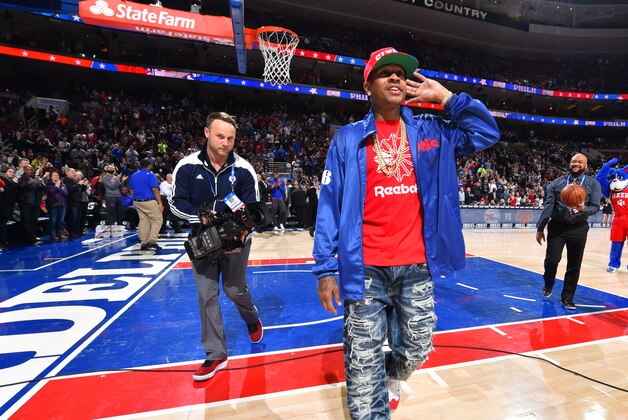 PHILADELPHIA,PA - APRIL 8: Hall of Famer Allen Iverson of the Philadelphia 76ers raises his hand to address the fans cheering prior to the game against New York Knicks the at Wells Fargo Center on April 8, 2016 in Philadelphia, Pennsylvania NOTE TO USER: User expressly acknowledges and agrees that, by downloading and/or using this Photograph, user is consenting to the terms and conditions of the Getty Images License Agreement. Mandatory Copyright Notice: Copyright 2016 NBAE (Photo by Jesse D. Garrabrant/NBAE via Getty Images)