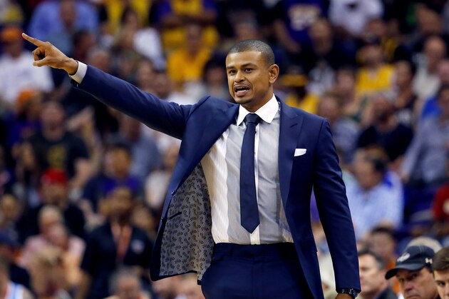 Phoenix Suns head coach Earl Watson makes a call during the first half of an NBA basketball game against the Los Angeles Lakers, Wednesday, March 23, 2016, in Phoenix. (AP Photo/Matt York)