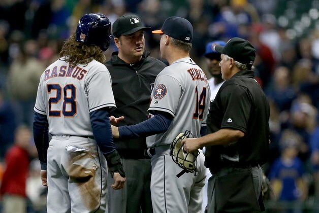 MILWAUKEE, WI - APRIL 8:  Manager A.J. Hinch and Colby Rasmus #28 of the Houston Astros argue a call by umpire Mike DiMuro, center, that ended the game against the Milwaukee Brewers at Miller Park April 8, 2016 in Milwaukee, Wisconsin. (Photo by Dylan Buell/Getty Images)