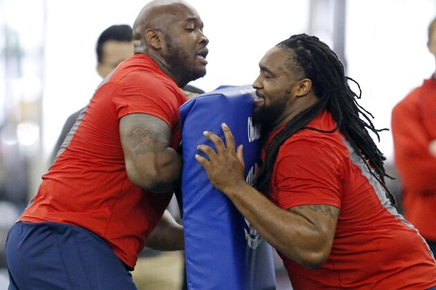 Offensive linemen Laremy Tunsil, left, blocks former teammate Justin Bell as they undergo a number of position drills during Mississippi's NFL football Pro Day, Monday, March 28, 2016, in Oxford, Miss. The event is to showcase players for the upcoming NFL football draft. (AP Photo/Rogelio V. Solis)