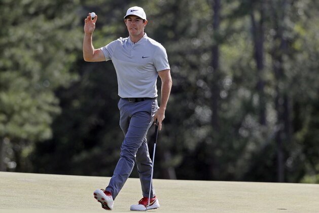 Rory McIlroy, of Northern Ireland, holds up his ball after putting out on the 18th hole during the second round of the Masters golf tournament Friday, April 8, 2016, in Augusta, Ga. (AP Photo/Chris Carlson)