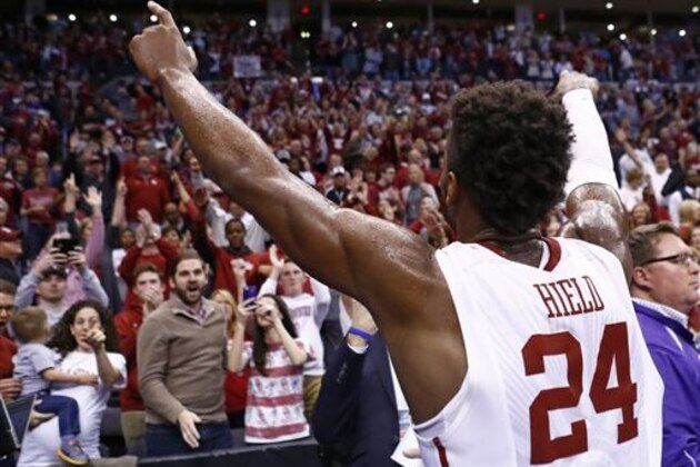 FILE - In this March 20, 2016, file photo, Oklahoma guard Buddy Hield (24) gestures to the Oklahoma crowd following a second-round men's college basketball game against VCU in the NCAA Tournament, in Oklahoma City. Buddy Hield had big expectations when he returned to Oklahoma for his senior season. Things have gone even better than expected. The sharpshooting guard has averaged 29.3 points in the NCAA Tournament heading into the Sooners’ national semifinal Saturday against Villanova. (AP Photo/Alonzo Adams)