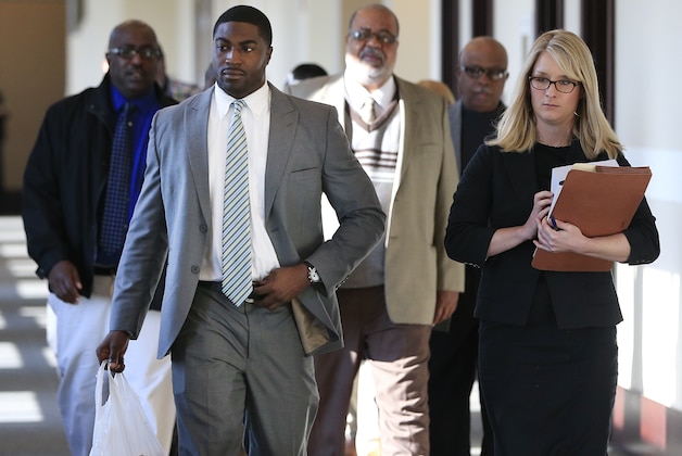 Former Vanderbilt University football player Cory Batey, front left, arrives for jury selection in his trial Monday, Nov. 3, 2014, in Nashville, Tenn. Batey and former teammate Brandon Vandenburg are charged with the rape of an unconscious 21-year-old female student on June 23, 2013. (AP Photo/Mark Humphrey)