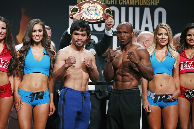 Manny Pacquiao, center left, of the Philippines, and Timothy Bradley, center right, pose during a weigh-in, Friday, April 8, 2016, in Las Vegas. The two are scheduled to fight in a welterweight title fight Saturday in Las Vegas. (AP Photo/John Locher)