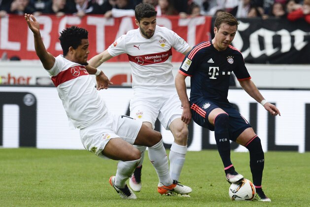 (L-R) Stuttgart's midfielder Daniel Didavi and Argentine defender Emiliano Adriano Insua and Bayern Munich's midfielder Mario Goetze vie for the ball during the German Bundesliga first division football match between VFB Stuttgart and FC Bayern Munich in Munich, southern Germany , on April 9, 2016.  / AFP / THOMAS KIENZLE / RESTRICTIONS: DURING MATCH TIME: DFL RULES TO LIMIT THE ONLINE USAGE TO 15 PICTURES PER MATCH AND FORBID IMAGE SEQUENCES TO SIMULATE VIDEO. == RESTRICTED TO EDITORIAL USE == FOR FURTHER QUERIES PLEASE CONTACT DFL DIRECTLY AT + 49 69 650050
        (Photo credit should read THOMAS KIENZLE/AFP/Getty Images)