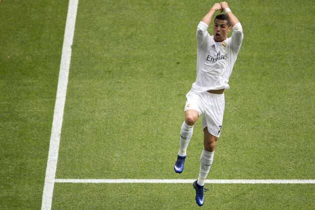 MADRID, SPAIN - APRIL 09:  Cristiano Ronaldo (R) of Real Madrid CF celebrates scoring their third goal during the La Liga match between Real Madrid CF and SD Eibar at Estadio Santiago Bernabeu on April 9, 2016 in Madrid, Spain.  (Photo by Gonzalo Arroyo Moreno/Getty Images)