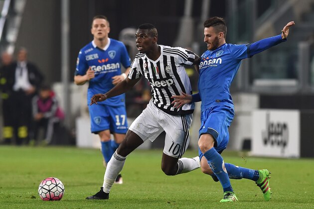 TURIN, ITALY - APRIL 02:  Paul Pogba (L) of Juventus FC is challenged by Luca Bittante of Empoli FC during the Serie A match between Juventus FC and Empoli FC at Juventus Arena on April 2, 2016 in Turin, Italy.  (Photo by Valerio Pennicino/Getty Images)