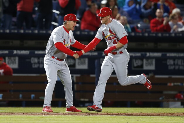 ATLANTA, GA - APRIL 08:  Pinch hitter Jeremy Hazelbaker #41 of the St. Louis Cardinals is congratulated by third base coach Chris Maloney #77 after Hazelbaker's seventh inning home run during the game against the Atlanta Braves at Turner Field on April 8, 2016 in Atlanta, Georgia.  (Photo by Mike Zarrilli/Getty Images)