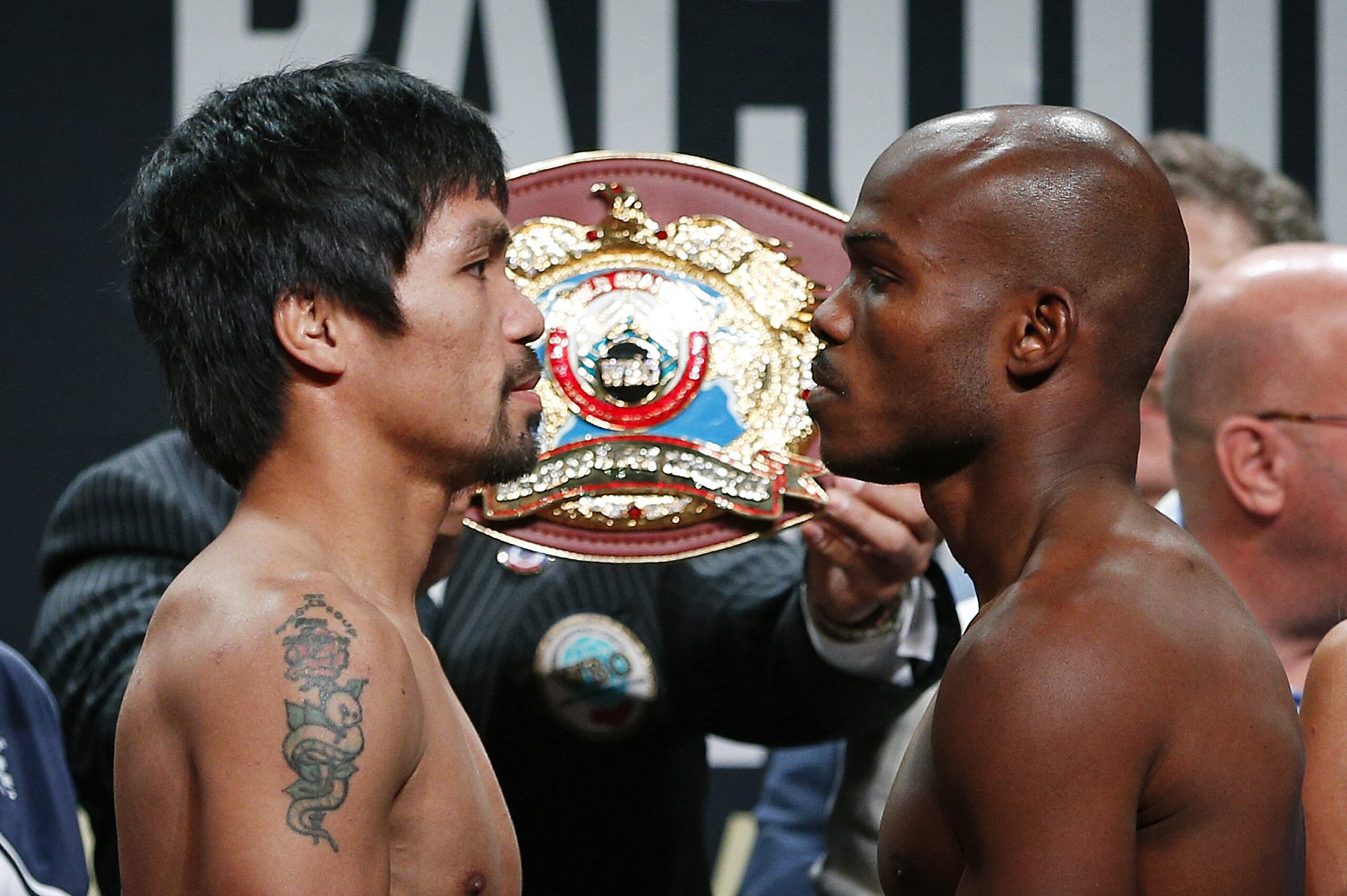 Manny Pacquiao, left, of the Philippines,  and Timothy Bradley pose during a weigh-in, Friday, April 8, 2016, in Las Vegas. Thy are scheduled to fight in a welterweight title fight Saturday in Las Vegas. (AP Photo/John Locher)