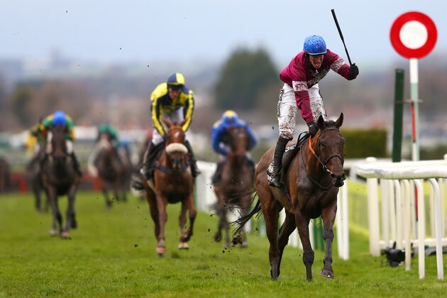 LIVERPOOL, ENGLAND - APRIL 09:  David Mullins celebrates as he rides Rule The World to victory in the 2016 Crabbie's Grand National at Aintree Racecourse on April 9, 2016 in Liverpool, England.  (Photo by Michael Steele/Getty Images)