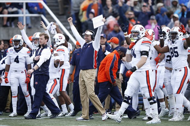 BIRMINGHAM, AL - DECEMBER 30: Head coach Gus Malzahn of the Auburn Tigers celebrates after a touchdown against the Memphis Tigers during the Birmingham Bowl at Legion Field on December 30, 2015 in Birmingham, Alabama. Auburn defeated Memphis 31-10. (Photo by Joe Robbins/Getty Images)
