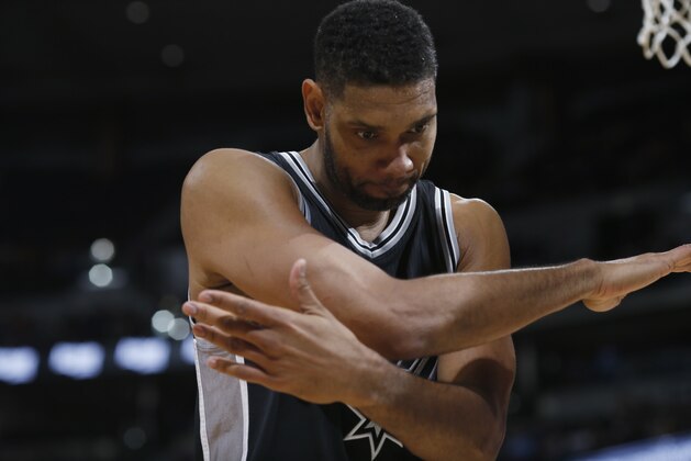 San Antonio Spurs center Tim Duncan reacts after drawing a foul while going up for a basket against the Denver Nuggets during the second half of an NBA basketball game Friday, April 8, 2016, in Denver. The Nuggets won 102-98. (AP Photo/David Zalubowski) San Antonio Spurs center Tim Duncan reacts after drawing a foul while going up for a basket against the Denver Nuggets during the second half of an NBA basketball game Friday, April 8, 2016, in Denver. The Nuggets won 102-98. (AP Photo/David Zalubowski)