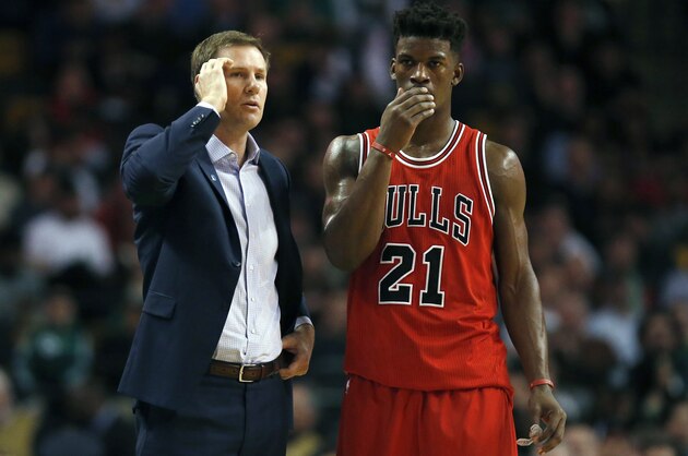 Chicago Bulls head coach Fred Hoiberg, left, talks with Jimmy Butler (21)  during the second half of an NBA basketball game against the Boston Celtics in Boston, Wednesday, Dec. 9, 2015. The Celtics won 105-100. (AP Photo/Michael Dwyer)