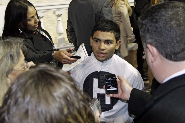Jockey Luis Saez speaks with the media after riding Will Take Charge to victory in the $500,000 Clark Handicap (Gr. I) horse race at Churchill Downs in Louisville, Ky., Friday, Nov. 29, 2013. (AP Photo/Garry Jones)