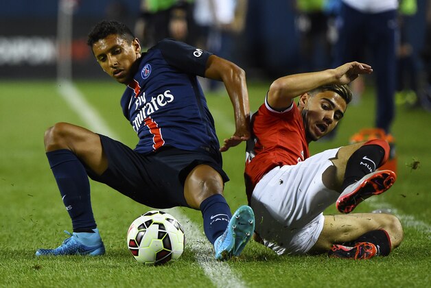 Jul 29, 2015; Chicago, IL, USA; Paris Saint-Germain defender Marquinhos (5) tackles Manchester United midfielder Andreas Pereira (44) during the second half at Soldier Field. Paris Saint-Germain defeats Manchester United 2-0. Mandatory Credit: Mike DiNovo-USA TODAY Sports