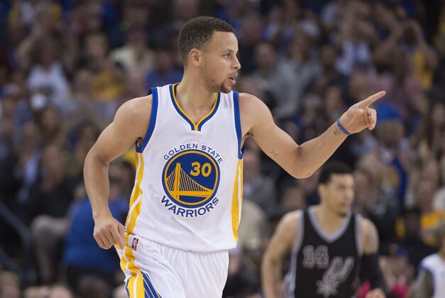 April 7, 2016; Oakland, CA, USA; Golden State Warriors guard Stephen Curry (30) celebrates after making a three-point basket during the second quarter against the San Antonio Spurs at Oracle Arena. Mandatory Credit: Kyle Terada-USA TODAY Sports