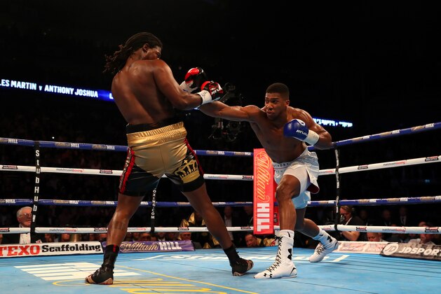 LONDON, ENGLAND - APRIL 09:  Anthony Joshua of England lands a punch on  Charles Martin of the United States during the IBF World Heavyweight title fight at The O2 Arena on April 9, 2016 in London, England.  (Photo by Richard Heathcote/Getty Images)