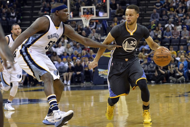 Golden State Warriors guard Stephen Curry (30) controls the ball against Memphis Grizzlies forward Zach Randolph (50) in the first half of an NBA basketball game Saturday, April 9, 2016, in Memphis, Tenn. (AP Photo/Brandon Dill)