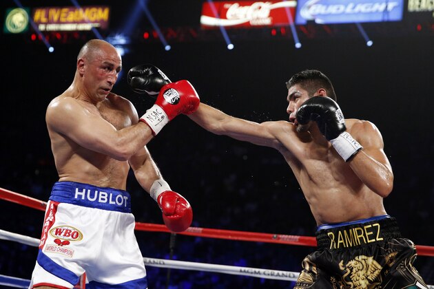 Gilberto Ramirez, of Mexico, throws a right to Arthur Abraham, of Germany, during their WBO super middleweight title boxing bout Saturday, April 9, 2016, in Las Vegas. (AP Photo/John Locher)
