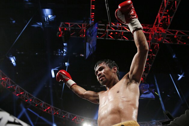Manny Pacquiao, of the Philippines, celebrates after defeating Timothy Bradley in the WBO welterweight title boxing bout Saturday, April 9, 2016, in Las Vegas. (AP Photo/John Locher)