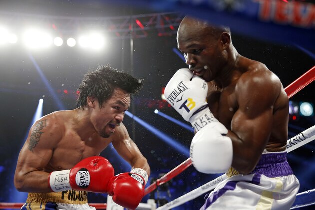 Manny Pacquiao, left, of the Philippines, fights Timothy Bradley during their WBO welterweight title boxing bout Saturday, April 9, 2016, in Las Vegas. (AP Photo/Isaac Brekken)