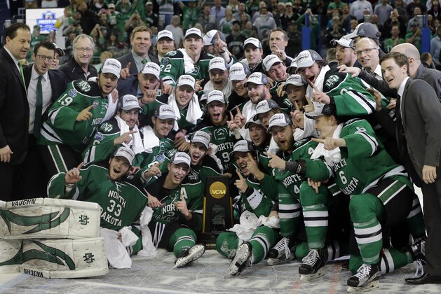 North Dakota celebrates their 5-1 win over Quinnipiac during an NCAA Frozen Four championship college hockey game Saturday, April 9, 2016, in Tampa, Fla. (AP Photo/Chris O'Meara)
