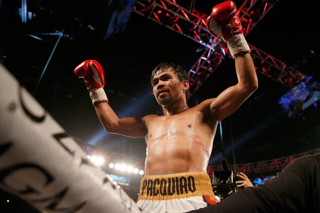 LAS VEGAS, NEVADA - APRIL 09:  Manny Pacquiao celebrates after defeating Timothy Bradley Jr. by unanimous decision in their welterweight championship fight on April 9, 2016 at MGM Grand Garden Arena in Las Vegas, Nevada.  (Photo by Christian Petersen/Getty Images)