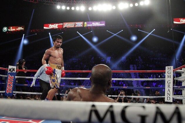 Manny Pacquiao sends Timothy Bradley Jr. to the mat in the 10th round of their WBO International Welterweight title bout at the MGM Grand Arena on April 9, 2016 in Las Vegas, Nevada. 
Pacquio won a 12 round unanimous decision to capture the WBO International Welterweight Title. / AFP / John GURZINSKI        (Photo credit should read JOHN GURZINSKI/AFP/Getty Images)