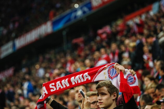 Bayern Munich fans are seen prior to kick off for the Champions League quarter-final, first-leg football match between Bayern Munich and Benfica Lisbon in Munich, southern Germany, on April 5, 2016. / AFP / ODD ANDERSEN        (Photo credit should read ODD ANDERSEN/AFP/Getty Images)