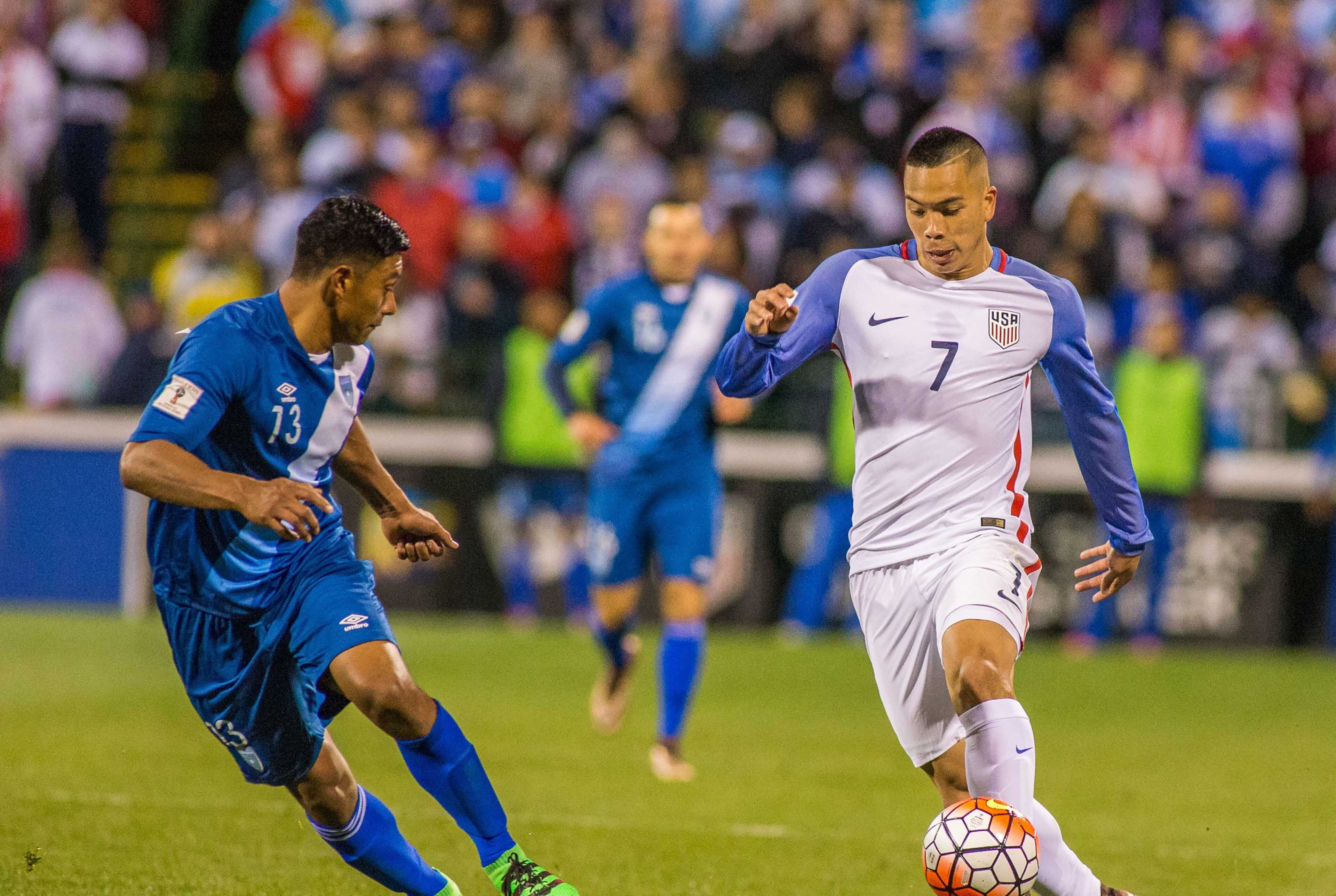 Mar 29, 2016; Columbus, OH, USA; United States forward Bobby Wood (7) dribbles the ball while Guatemala defender Carlos Castrillo (13) defends in the second half of the game during the semifinal round of the 2018 FIFA World Cup qualifying soccer tournament at MAPFRE Stadium. The United States beats Guatemala by the score of 4-0. Mandatory Credit: Trevor Ruszkowski-USA TODAY Sports