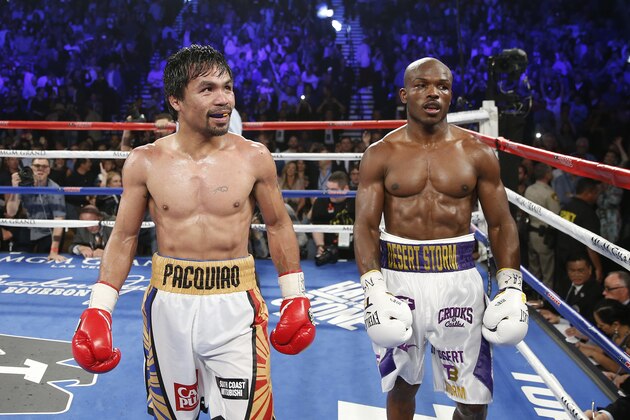 Manny Pacquiao, left, of the Philippines, and Timothy Bradley walk to the corner of the ring after their WBO welterweight title boxing bout Saturday, April 9, 2016, in Las Vegas. (AP Photo/Isaac Brekken)