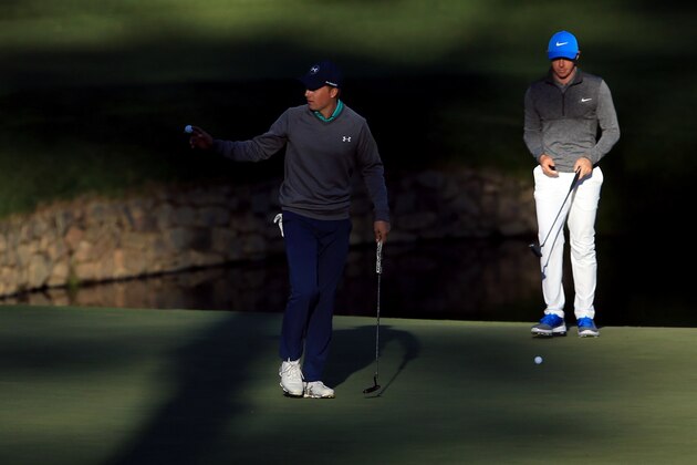 AUGUSTA, GEORGIA - APRIL 09:  Jordan Spieth of the United States reacts on the 15th hole as Rory McIlroy of Northern Ireland looks on during the third round of the 2016 Masters Tournament at Augusta National Golf Club on April 9, 2016 in Augusta, Georgia.  (Photo by David Cannon/Getty Images)