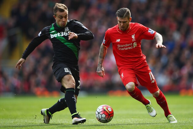 LIVERPOOL, UNITED KINGDOM - APRIL 10:  Alberto Moreno of Liverpool is challenged by Xherdan Shaqiri of Stoke City during the Barclays Premier League match between Liverpool and Stoke City at Anfield on April 10, 2016 in Liverpool, England.  (Photo by Clive Brunskill/Getty Images)