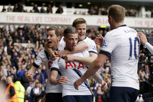 Tottenham Hotspur's Toby Alderweireld, center, celebrates scoring his side's second goal with, from left, Jan Vertonghen, Eric Dier and Harry Kane during the English Premier League soccer match between Tottenham Hotspur and Manchester United at White Hart Lane stadium in London, Sunday, April 10, 2016. (AP Photo/Matt Dunham)