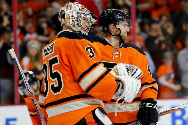 PHILADELPHIA, PA - APRIL 02:  Steve Mason #35 and Andrew MacDonald #47 of the Philadelphia Flyers celebrate the win over the Ottawa Senators at the Wells Fargo Center on April 2, 2016 in Philadelphia, Pennsylvania.The Philadelphia Flyers defeated the Ottawa Senators 3-2.  (Photo by Elsa/Getty Images)