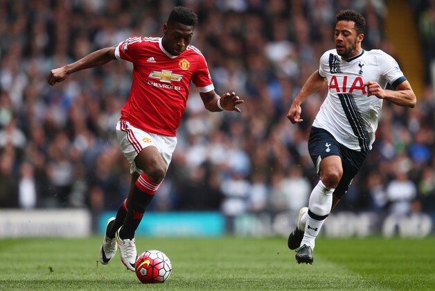 LONDON, ENGLAND - APRIL 10:  Timothy Fosu-Mensah of Manchester United is chased by Mousa Dembele of Tottenham Hotspur during the Barclays Premier League match between Tottenham Hotspur and Manchester United at White Hart Lane on April 10, 2016 in London, England.  (Photo by Julian Finney/Getty Images)