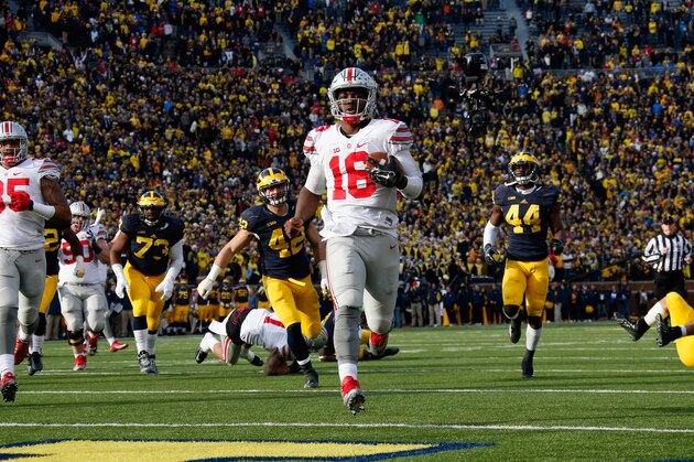 ANN ARBOR, MI - NOVEMBER 28: Quarterback J.T. Barrett #16 of the Ohio State Buckeyes rushes for a fourth quarter touchdown against the Michigan Wolverines at Michigan Stadium on November 28, 2015 in Ann Arbor, Michigan.  (Photo by Gregory Shamus/Getty Images)