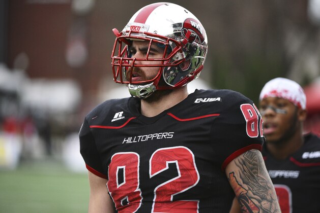 Western Kentucky tight end Tyler Higbee (82) watches the coin flip before taking on Marshall in an NCAA college football game on Friday, Nov. 27, 2015, at L.T. Smith Stadium in Bowling Green, Ky. (AP Photo/Michael Noble Jr.)