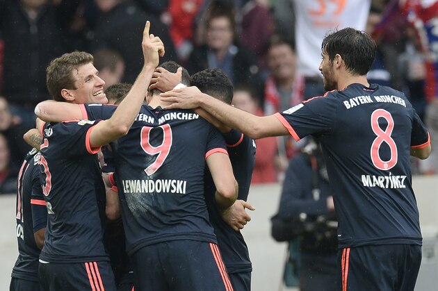 Bayern Munich's forward Thomas Mueller, Polish forward Robert Lewandowski and Spanish midfielder Javier Martinez celebrate with teammates during the German first division Bundesliga football match VfB Stuttgart vs Bayern Munich in Stuttgart, southwestern Germany, on April 9, 2016.  
Bayern Munich won 3-1. / AFP / THOMAS KIENZLE / RESTRICTIONS: DURING MATCH TIME: DFL RULES TO LIMIT THE ONLINE USAGE TO 15 PICTURES PER MATCH AND FORBID IMAGE SEQUENCES TO SIMULATE VIDEO. == RESTRICTED TO EDITORIAL USE == FOR FURTHER QUERIES PLEASE CONTACT DFL DIRECTLY AT + 49 69 650050
        (Photo credit should read THOMAS KIENZLE/AFP/Getty Images)