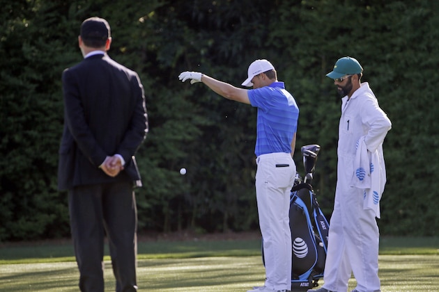 Jordan Spieth takes a second drop on the 12th hole after landing the water twice during the final round of the Masters golf tournament Sunday, April 10, 2016, in Augusta, Ga. (AP Photo/David J. Phillip)