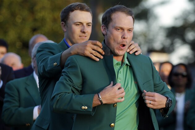 Defending champion Jordan Spieth, left, helps 2016 Masters champion Danny Willett, of England, put on his green jacket following the final round of the Masters golf tournament Sunday, April 10, 2016, in Augusta, Ga. (AP Photo/Chris Carlson) Defending champion Jordan Spieth, left, helps 2016 Masters champion Danny Willett, of England, put on his green jacket following the final round of the Masters golf tournament Sunday, April 10, 2016, in Augusta, Ga. (AP Photo/Chris Carlson)