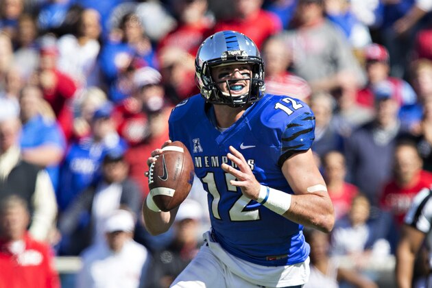 MEMPHIS, TN - OCTOBER 17:  Paxton Lynch #12 of the Memphis Tigers rolls out to pass during a game against the Ole Miss Rebels at Liberty Bowl Memorial Stadium on October 17, 2015 in Memphis, Tennessee.  The Tigers defeated the Rebels 37-24.  (Photo by Wesley Hitt/Getty Images)