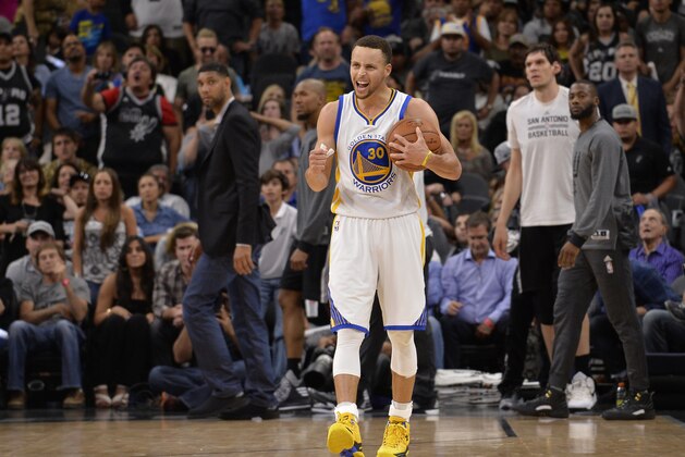 Golden State Warriors guard Stephen Curry celebrates the win after an NBA basketball game against the San Antonio Spurs, Sunday, April 10, 2016, in San Antonio. Golden State won 92-86. (AP Photo/Darren Abate)
