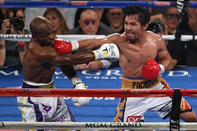 LAS VEGAS, NEVADA - APRIL 09:  Manny Pacquiao (R) throws a right at Timothy Bradley Jr. in the seventh round of their welterweight fight at MGM Grand Garden Arena on April 9, 2016 in Las Vegas, Nevada. Pacquiao won by unanimous decision.  (Photo by Ethan Miller/Getty Images)